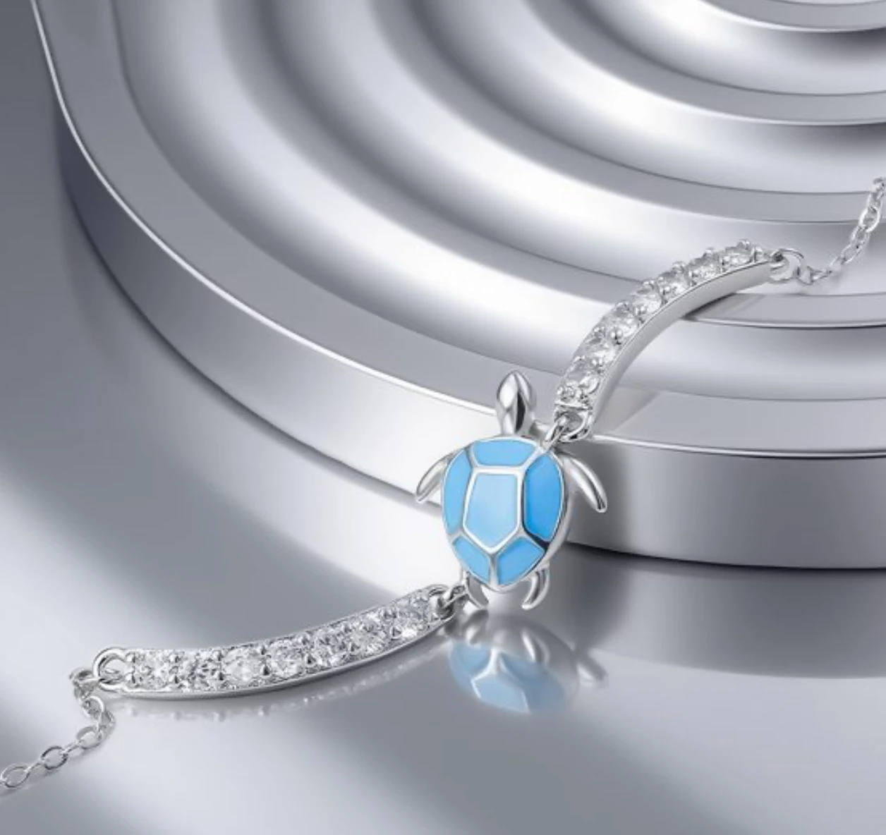 Close-up of the turtle motif on the blue sea turtle 925 sterling silver bracelet