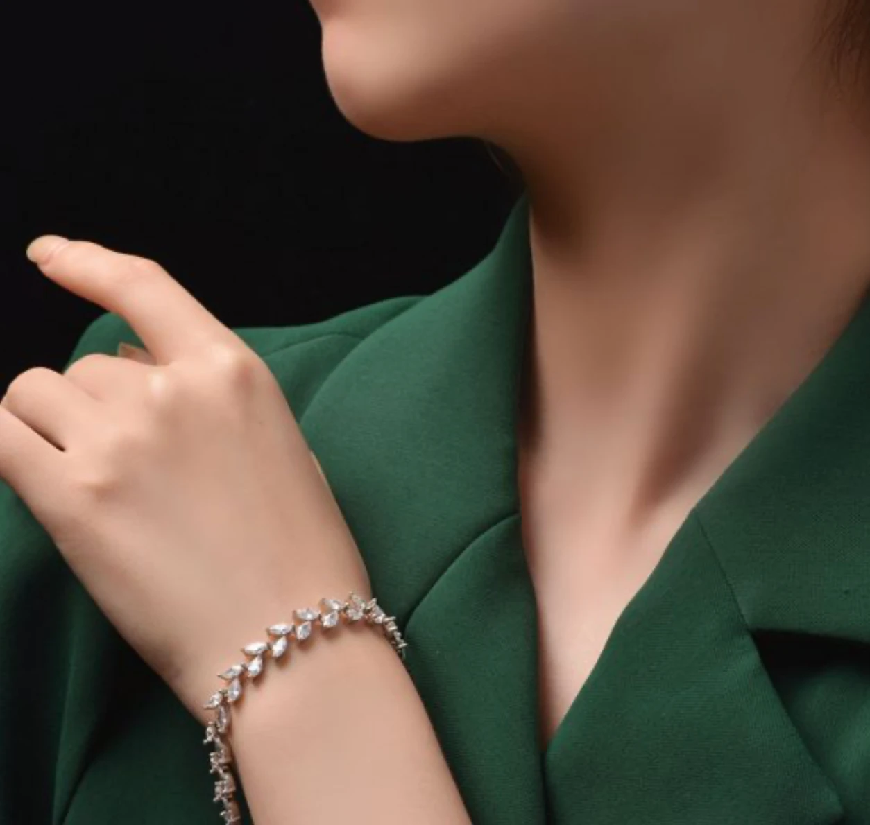 Silver marquise-cut zirconia vine link bracelet worn on the wrist